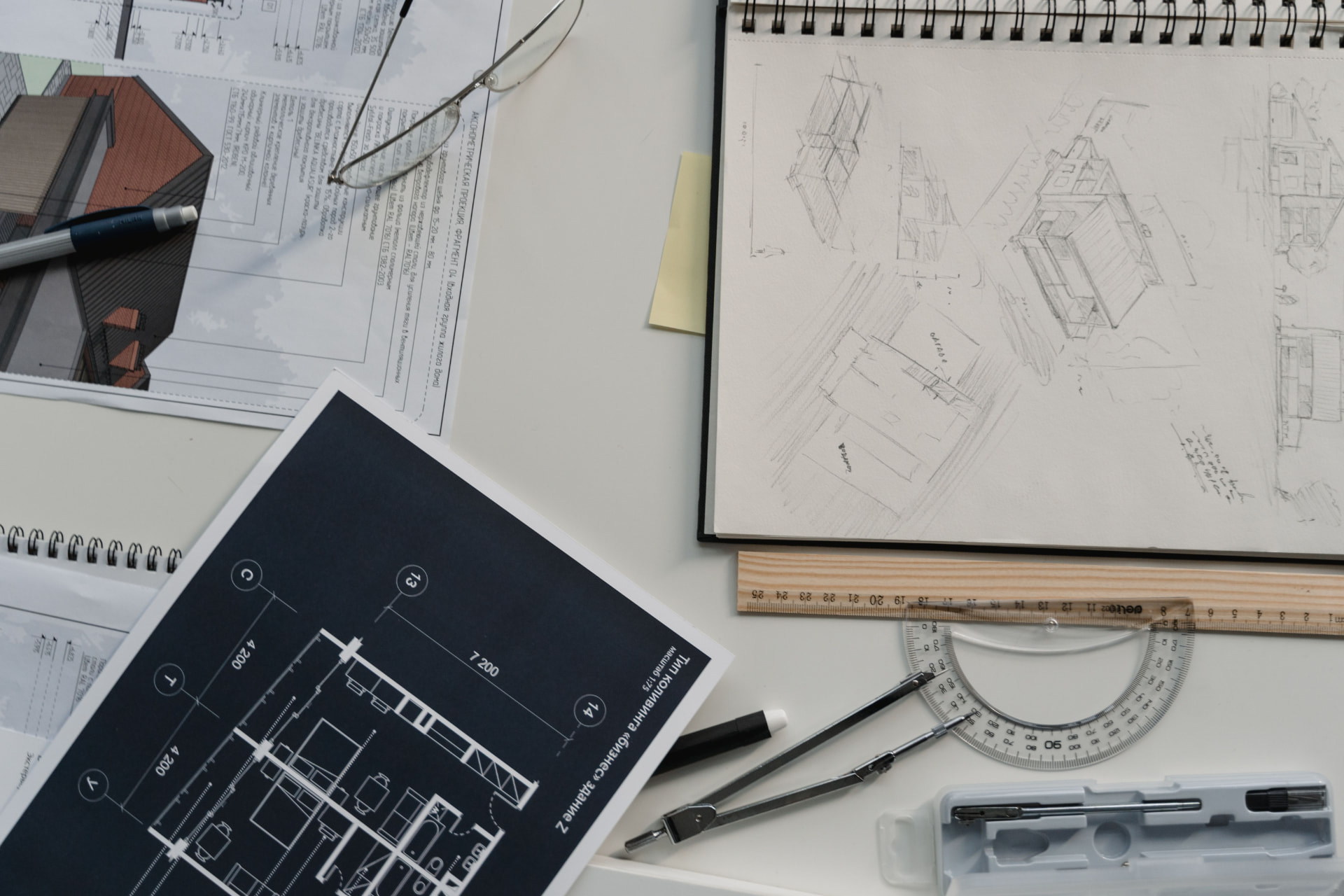 Steel fabrication drawings, sketches and drafting tools on a designer’s desk